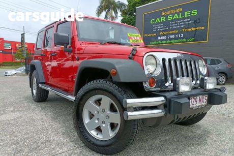 Red 2010 Jeep Wrangler Softtop Unlimited Sport (4X4)