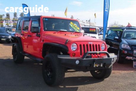 Red 2014 Jeep Wrangler Softtop Unlimited Sport (4X4)