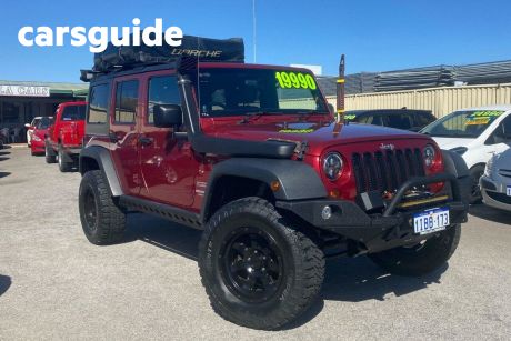 Red 2011 Jeep Wrangler Convertible Unlimited Sport