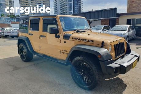 Yellow 2014 Jeep Wrangler Softtop Unlimited Sport (4X4)