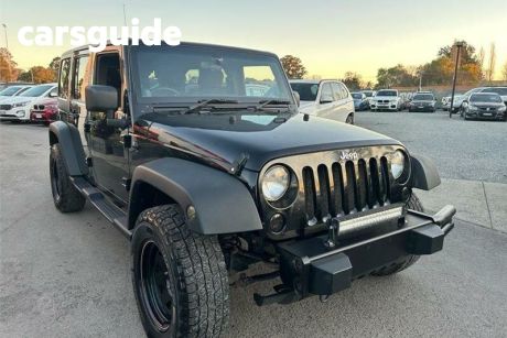 Black 2011 Jeep Wrangler Softtop Unlimited Sport (4X4)