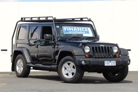 Black 2012 Jeep Wrangler Softtop Unlimited Sport (4X4)