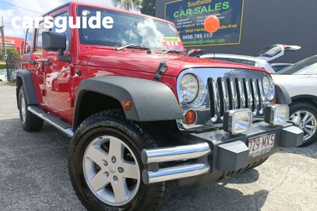 Red 2010 Jeep Wrangler Softtop Unlimited Sport (4X4)