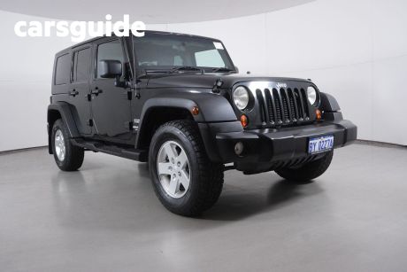 Black 2010 Jeep Wrangler Softtop Unlimited Sport (4X4)