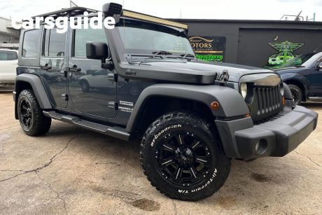 Blue 2009 Jeep Wrangler Softtop Unlimited Sport (4X4)