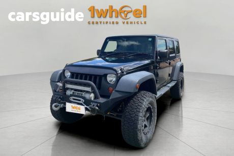 Black 2014 Jeep Wrangler Softtop Unlimited Sport (4X4)