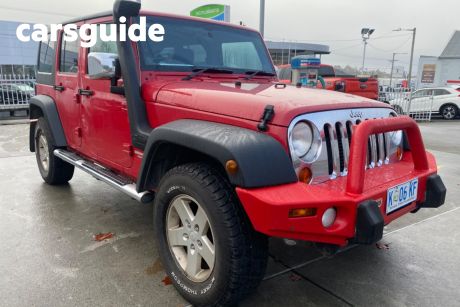 Red 2011 Jeep Wrangler Softtop Unlimited Sport (4X4)