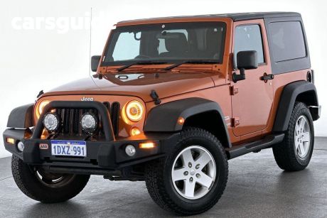 Orange 2012 Jeep Wrangler Softtop Sport (4X4)