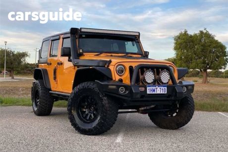 Yellow 2013 Jeep Wrangler Softtop Unlimited Sport (4X4)