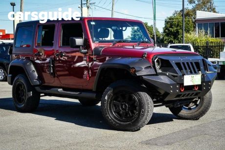 Red 2011 Jeep Wrangler Softtop Unlimited Sport (4X4)