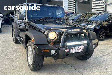 Black 2012 Jeep Wrangler Softtop Unlimited Sport (4X4)