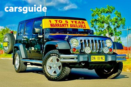 Black 2010 Jeep Wrangler Softtop Unlimited Sport (4X4)
