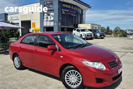Red 2010 Toyota Corolla Sedan Ascent