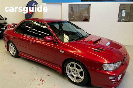 Red 2000 Subaru Impreza Sedan WRX (awd)