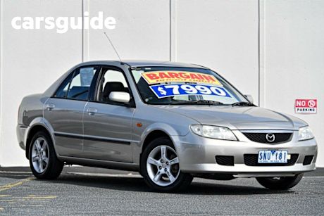 Gold 2003 Mazda 323 Sedan Protege Shades