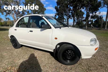 White 1997 Mazda 121 Sedan Shades