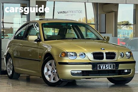 Yellow 2004 BMW 318TI Hatchback