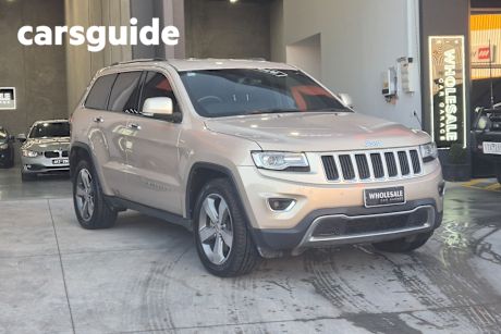 Beige 2013 Jeep Grand Cherokee Wagon Limited (4X4)