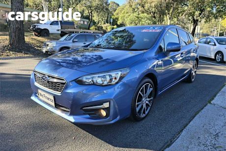 Blue 2017 Subaru Impreza Hatchback 2.0L (awd)