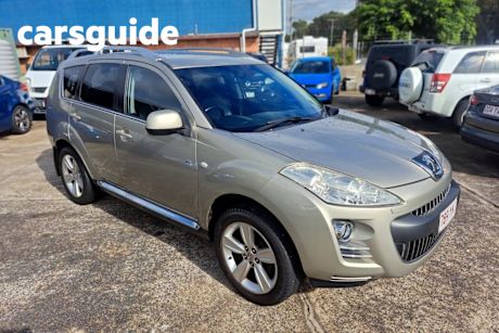 Yellow 2009 Peugeot 4007 Wagon SV (7 Seat)