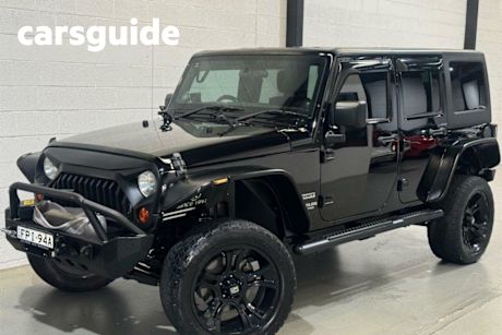 Black 2012 Jeep Wrangler Convertible Unlimited Sport