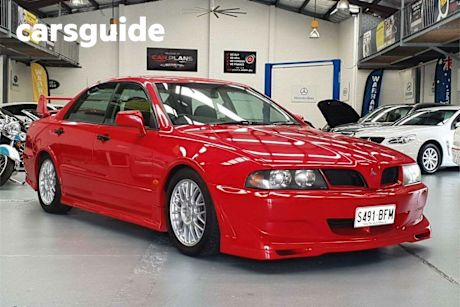 Red 2003 Mitsubishi Magna Sedan Ralliart