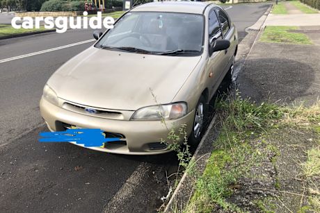 Tan 1994 Ford Laser Hatchback LXI Liata