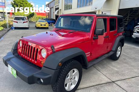 Red 2011 Jeep Wrangler Softtop Unlimited Sport (4X4)
