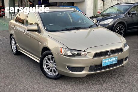 Gold 2010 Mitsubishi Lancer Sedan ES