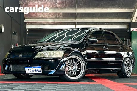 Black 2002 Mitsubishi Lancer Sedan Evolution VII GT-A 4dr Sedan 5sp Auto 2.0i AWD