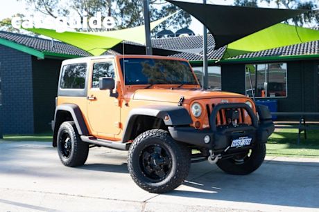 Orange 2012 Jeep Wrangler Softtop Sport (4X4)
