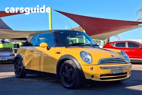 Yellow 2007 Mini Cabrio Cabriolet Cooper Sidewalk