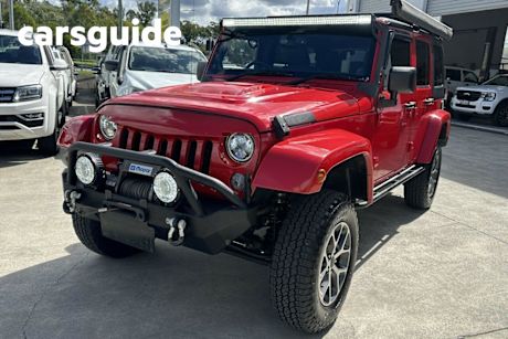 Red 2014 Jeep Wrangler Unlimited Softtop Freedom (4X4)