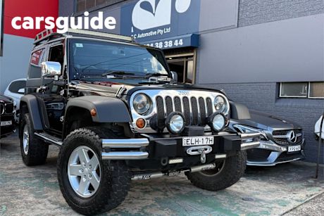 Black 2012 Jeep Wrangler Softtop Sport (4X4)