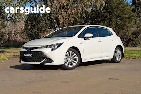 White 2024 Toyota Corolla Hatchback Ascent Sport + Conv PK Hybrid