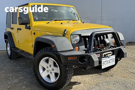 Yellow 2010 Jeep Wrangler Softtop Unlimited Sport (4X4)