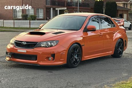 Orange 2012 Subaru WRX Sedan Premium (awd)