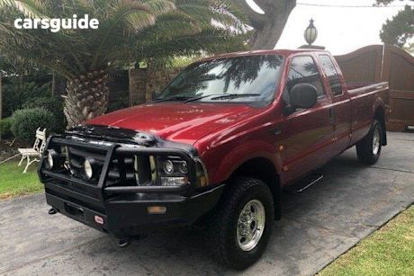 Red 2004 Ford F250 Super Cab Pickup XLT (4X4)