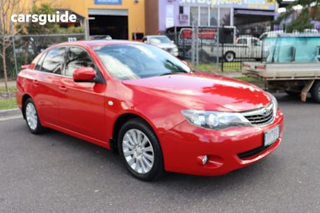 Red 2009 Subaru Impreza Sedan RX (awd)