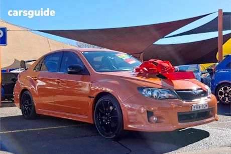 Orange 2012 Subaru WRX Sedan Club Spec (awd)