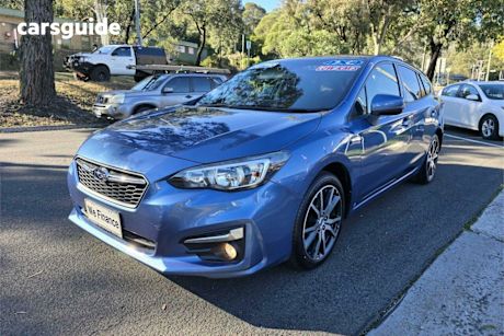 Blue 2017 Subaru Impreza Hatchback 2.0L (awd)