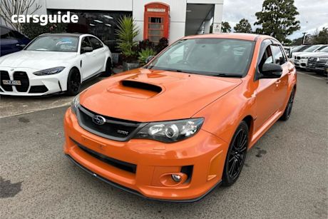 Orange 2012 Subaru WRX Sedan Club Spec (awd)
