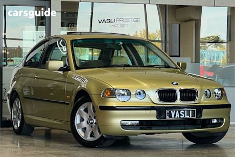 Yellow 2004 BMW 318TI Hatchback