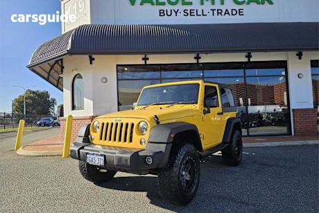 Yellow 2015 Jeep Wrangler Hardtop Renegade Sport (4X4)