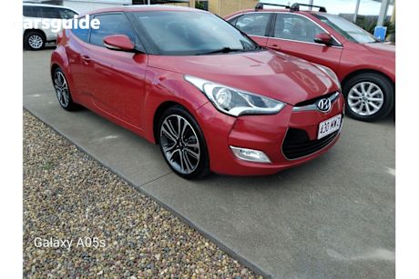 Red 2015 Hyundai Veloster Coupe +