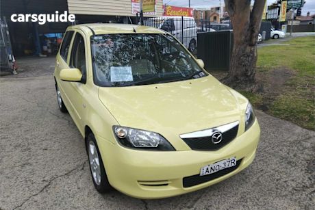 Yellow 2002 Mazda 2 Hatchback Maxx