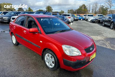 Red 2006 Kia RIO Sedan EX