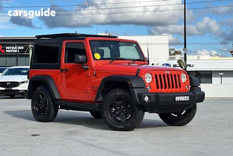 Orange 2015 Jeep Wrangler Hardtop Renegade Sport (4X4)