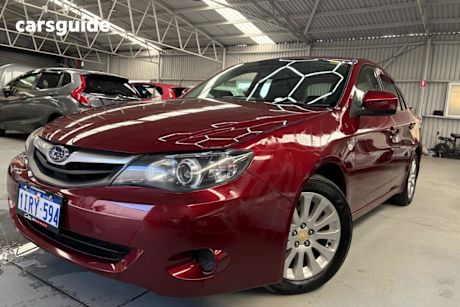 Red 2011 Subaru Impreza Sedan R (AWD) MY11