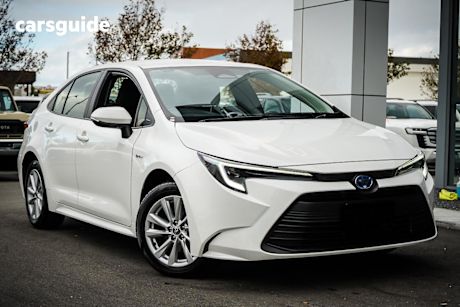 White 2025 Toyota Corolla Sedan Ascent Sport HEV
